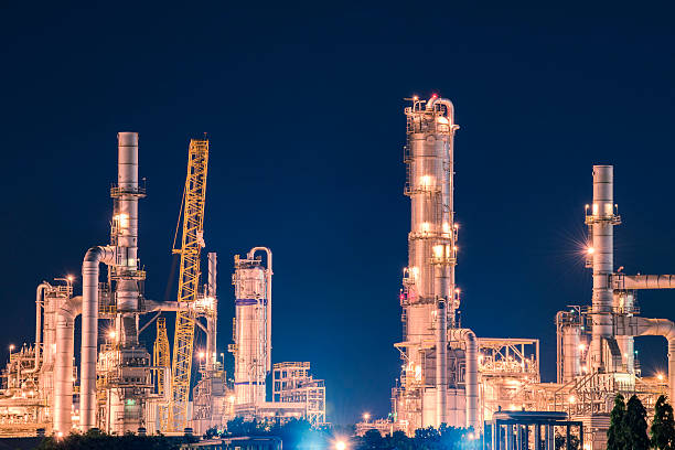 istock Oil and gas refinery in night 505406860