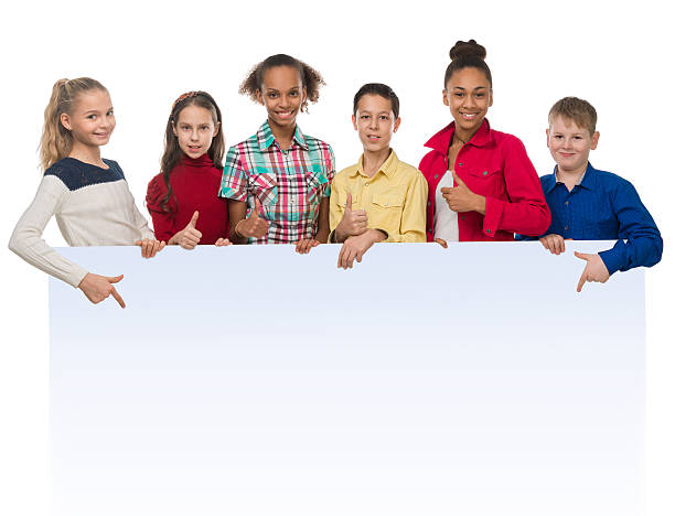 istock teenagers with thumbs up pointing at an ad blank 505408004