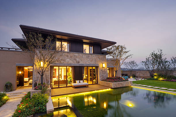 istock path near pond to modern building at twilight 505408634