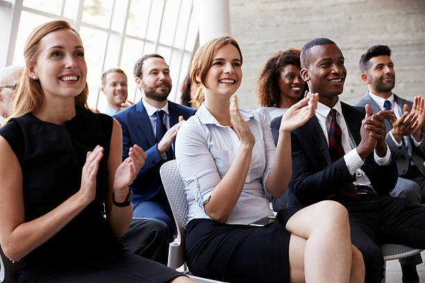 istock Audience Applauding Speaker At Business Conference 505410542