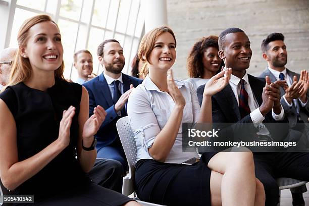 Audience Applauding Speaker At Business Conference Stock Photo - Download Image Now - Public Speaker, Audience, Conference - Event