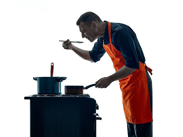 istock man cooking chef silhouette isolated 505410926