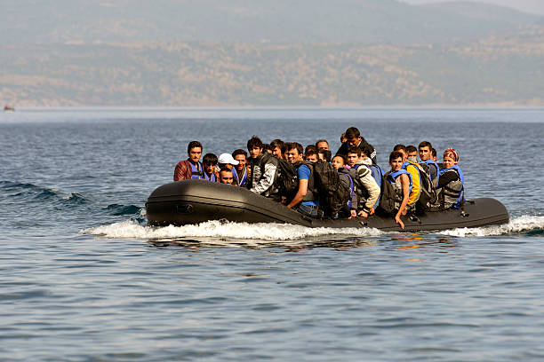 Refugees arrive at Greek island Lesvos stock photo