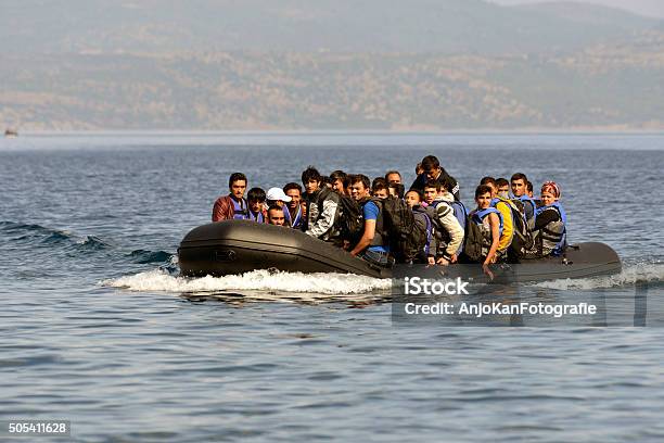 Refugees Arrive At Greek Island Lesvos Stock Photo - Download Image Now - Immigrant, Nautical Vessel, Syria