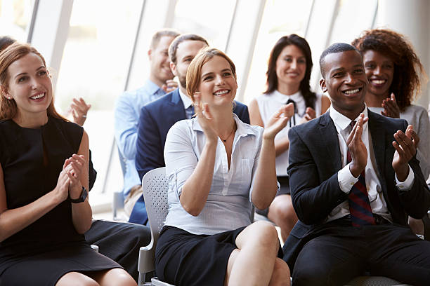 istock Audience Applauding Speaker At Business Conference 505411990