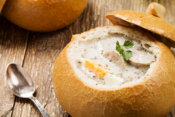 istock Traditional polish white borscht with eggs and sausage in bread 505412664