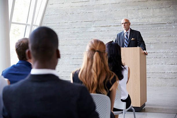 istock Senior Businessman Addressing Delegates At Conference 505413124