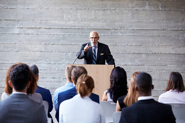 istock Senior Businessman Addressing Delegates At Conference 505413252