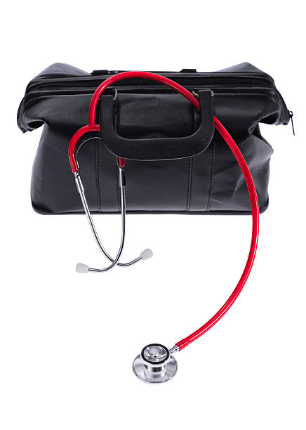 istock Doctor's bag and red stethoscope on a white background 505413584