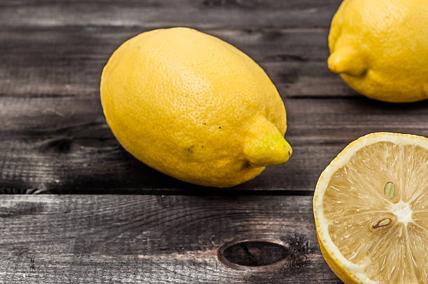 istock Fresh lemon fruit on wooden background. 505413970