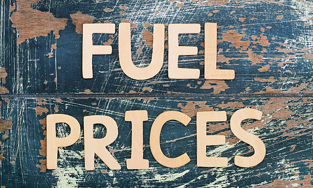istock Fuel prices written with wooden letters on rustic surface 505414196