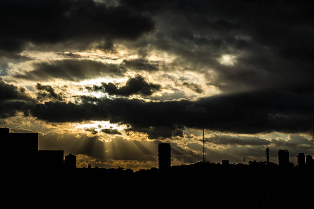 Large panorama of the sunlight passing through the clouds in a summer afternoon
