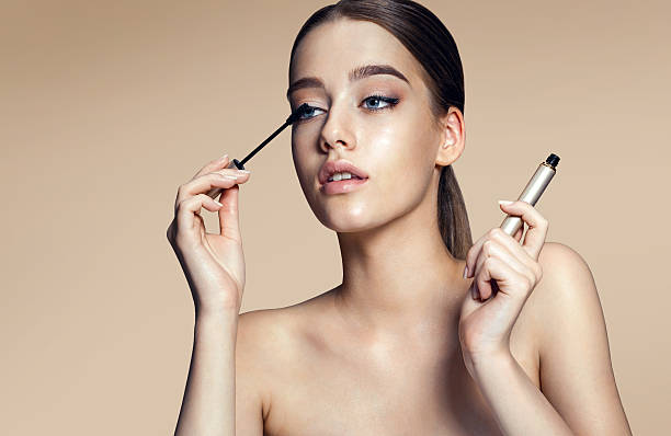 istock Woman applying mascara on her long eyelashes 505415102