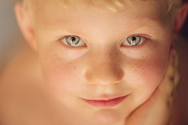 istock Boy looking up with blond hair 505438917