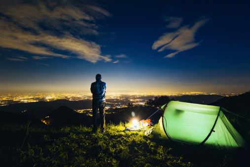 camping in the mountains at night.