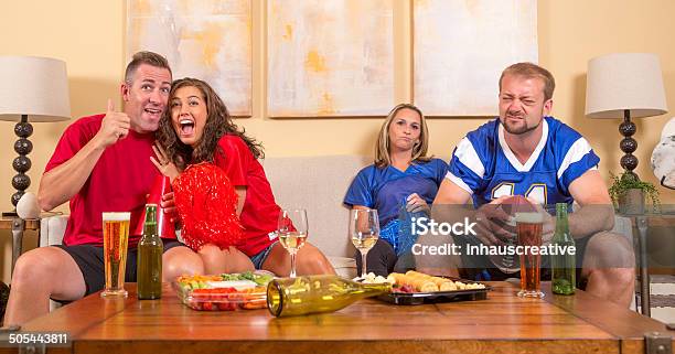 Football Sports Fans At Home Taunting Each Other Stock Photo - Download Image Now - 30-39 Years, Adult, Aggression