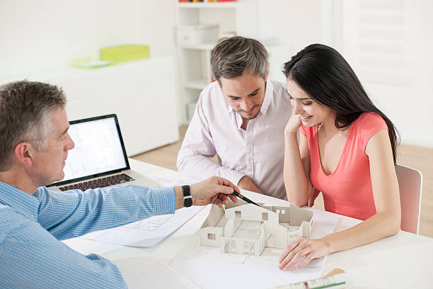 istock Young couple meeting construction planner 505444817