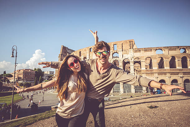 istock Couple in front of the Coliseum 505445101