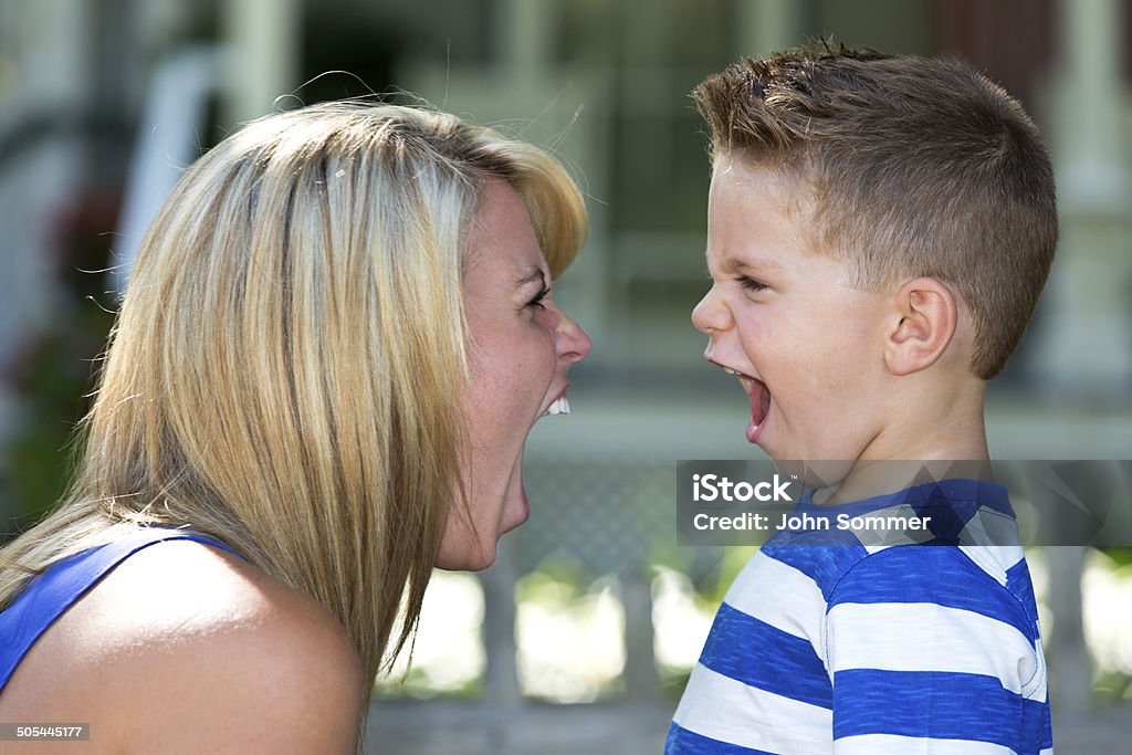 Arguing mother and son Mother and son face to face yelling at each other  Shouting Stock Photo