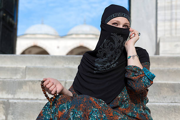 istock Smiling Arabic Woman Talking on Telephone 505464080