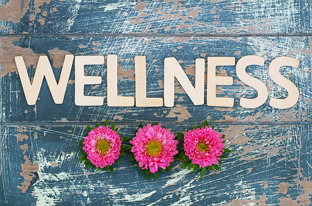 istock Wellness written with wooden letters on rustic surface 505464736