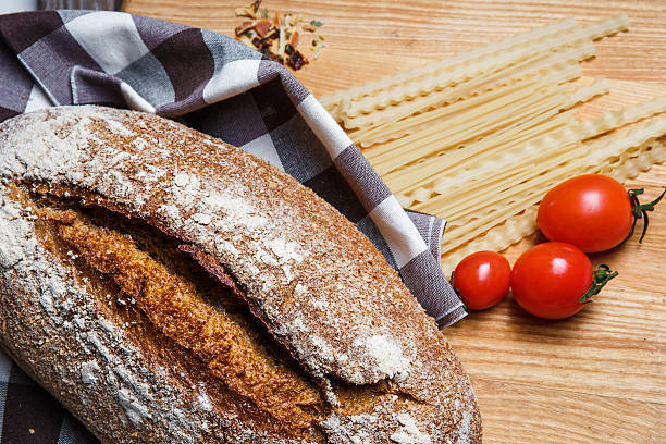 istock The bread on an wooden background 505465670