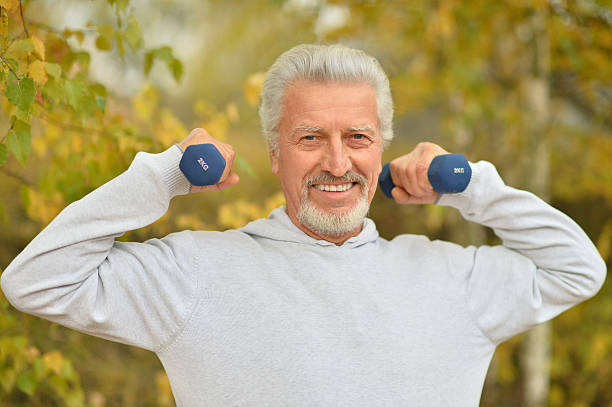 istock Elderly man exercising with dumbbells 505467574