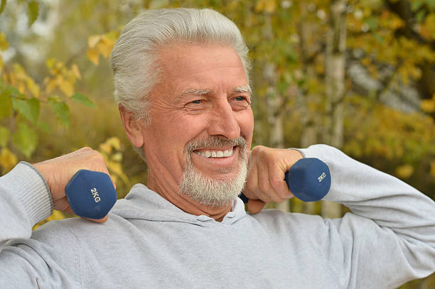 istock Elderly man exercising with dumbbells 505468168