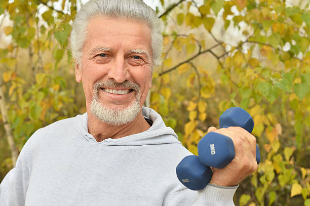 istock Elderly man exercising with dumbbells 505468626