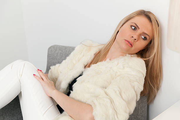istock Thoughtful woman resting in armchair 505468756