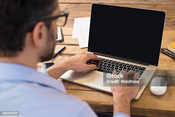 Man Working On Laptop Stock Photo - Download Image Now - Laptop, Men, Computer Monitor