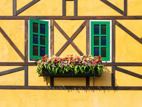 17. 07. 2023 Colmar, Alsace, France, yellow facades of traditional half-timbered houses and architectural details in old town Colmar.
