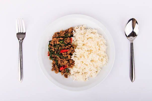 istock Thai stir-fried pork and basil served with rice. 505469848