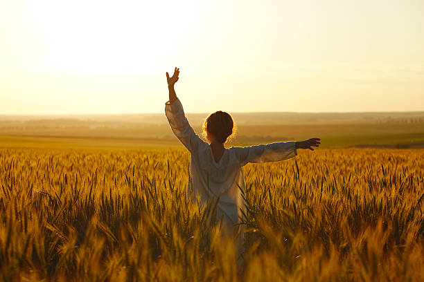 istock Happy young woman among rye field 505470696