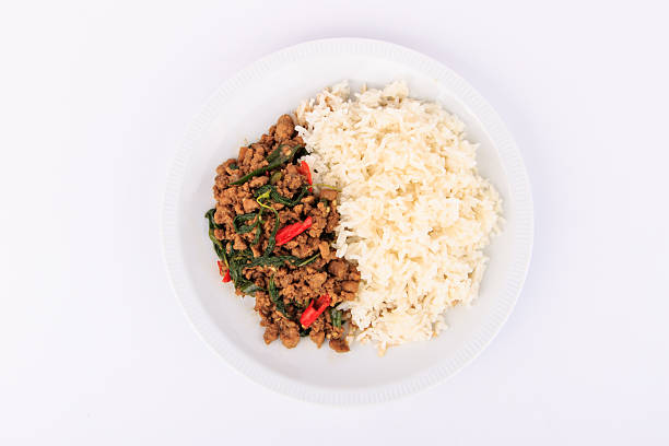 istock Thai stir-fried pork and basil served with rice. 505470700