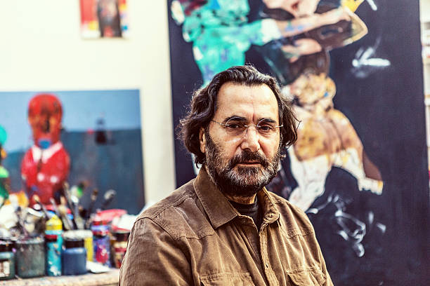 Painter Sitting Front of Easel in Art Sudio