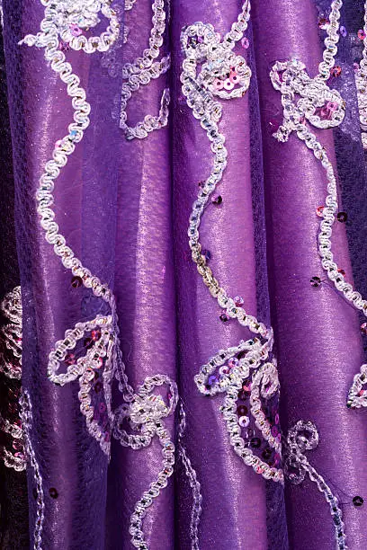 Photo of Purple fabric with embroidered pattern