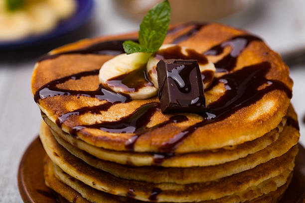 istock Delicious pancakes with bananas and chocolate. 505471212