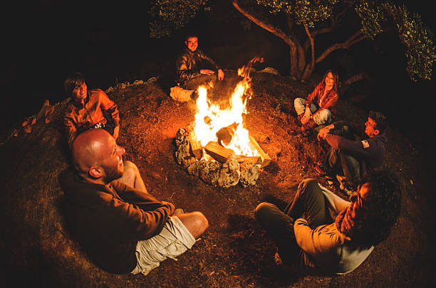 istock Campfire of friends in circle on the fire 505471395