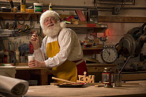 istock Santa Claus taking a break from working in his workshop 505471659