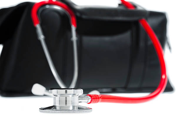 istock Red stethoscope and a Doctor's bag on a white background 505471930