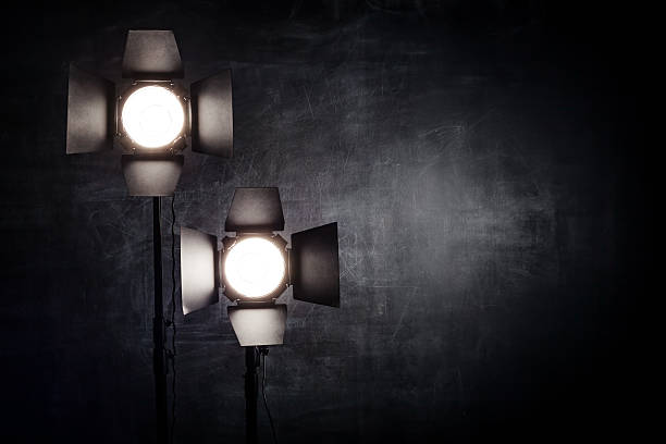 istock Lighting equipment on a black background old shabby wall 505472398