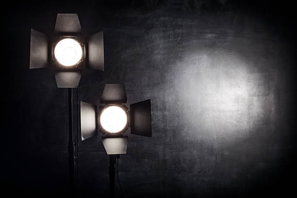istock Lighting equipment on a black background old shabby wall 505472484