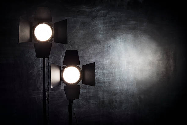 istock Lighting equipment on a black background old shabby wall 505472560