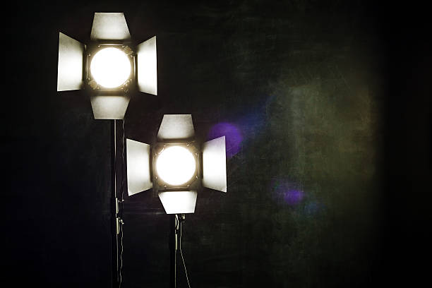 istock Lighting equipment on a black background old shabby wall 505472612