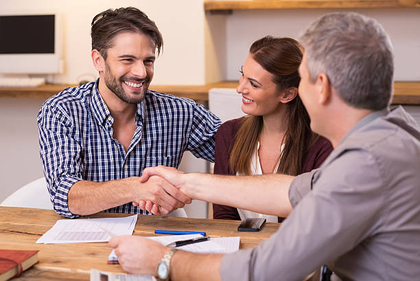 istock Couple shaking hand to financial agent 505472662
