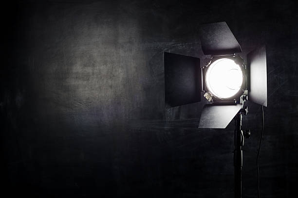 Lighting equipment on a black background old shabby wall