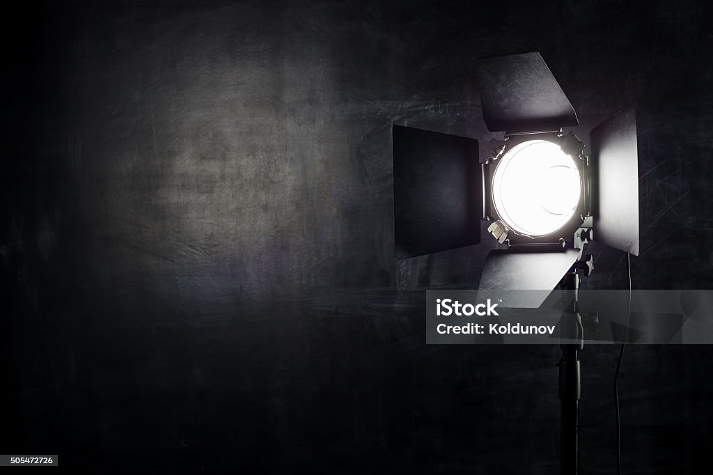 Lighting equipment on a black background old shabby wall Equipment for photo studios and fashion photography in the classroom on the chalk board background. Backstage Stock Photo