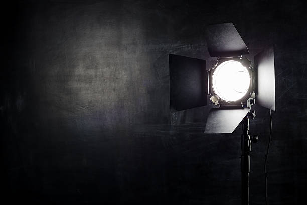 Lighting equipment on a black background old shabby wall Equipment for photo studios and fashion photography in the classroom on the chalk board background. backstage stock pictures, royalty-free photos & images