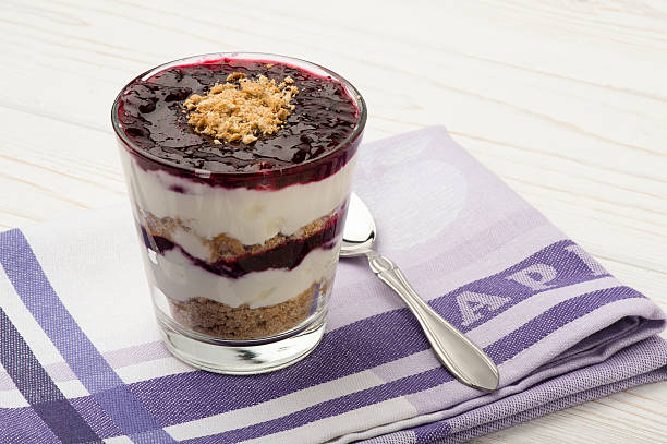 istock Healthy dessert with natural yogurt,biscuits and black currant jam. 505475910